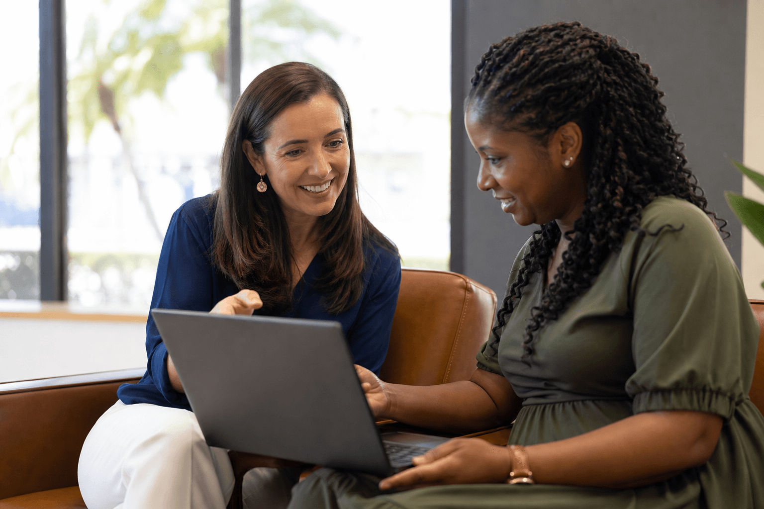 One on one adult tech coaching with a laptop open